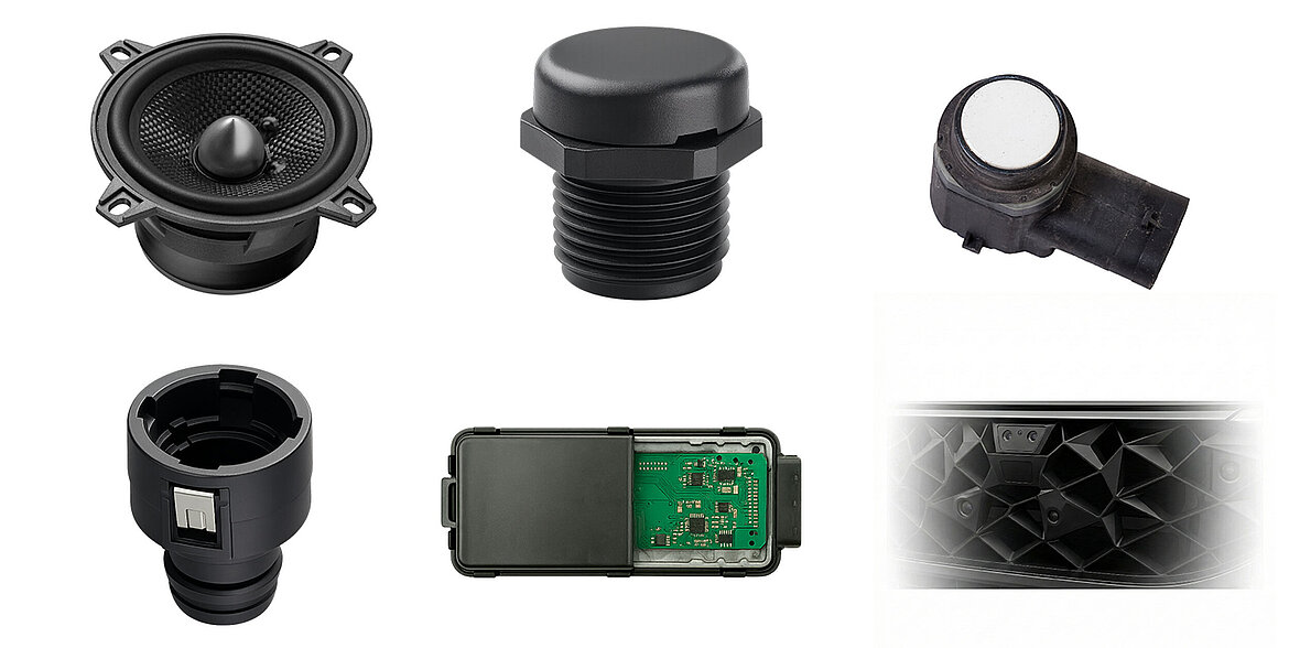Various black vehicle components such as sensors, a speaker and an electronics module