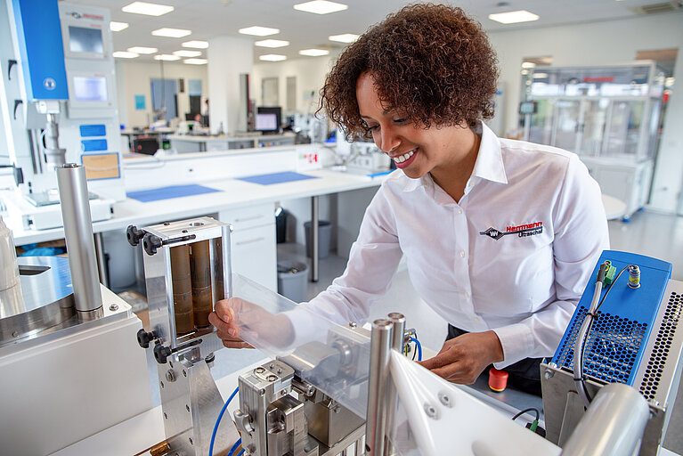 Colleague stretches the film for welding on the LSM