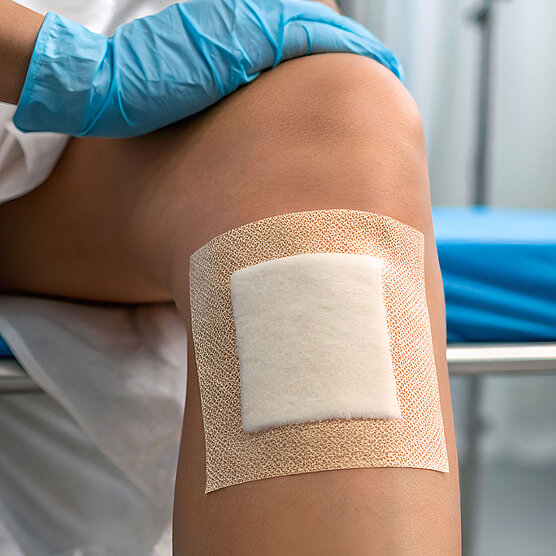 Large bandage on a knee