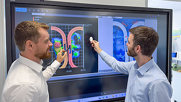 Ultrasonic welding data analyzed by two people on a large touchscreen